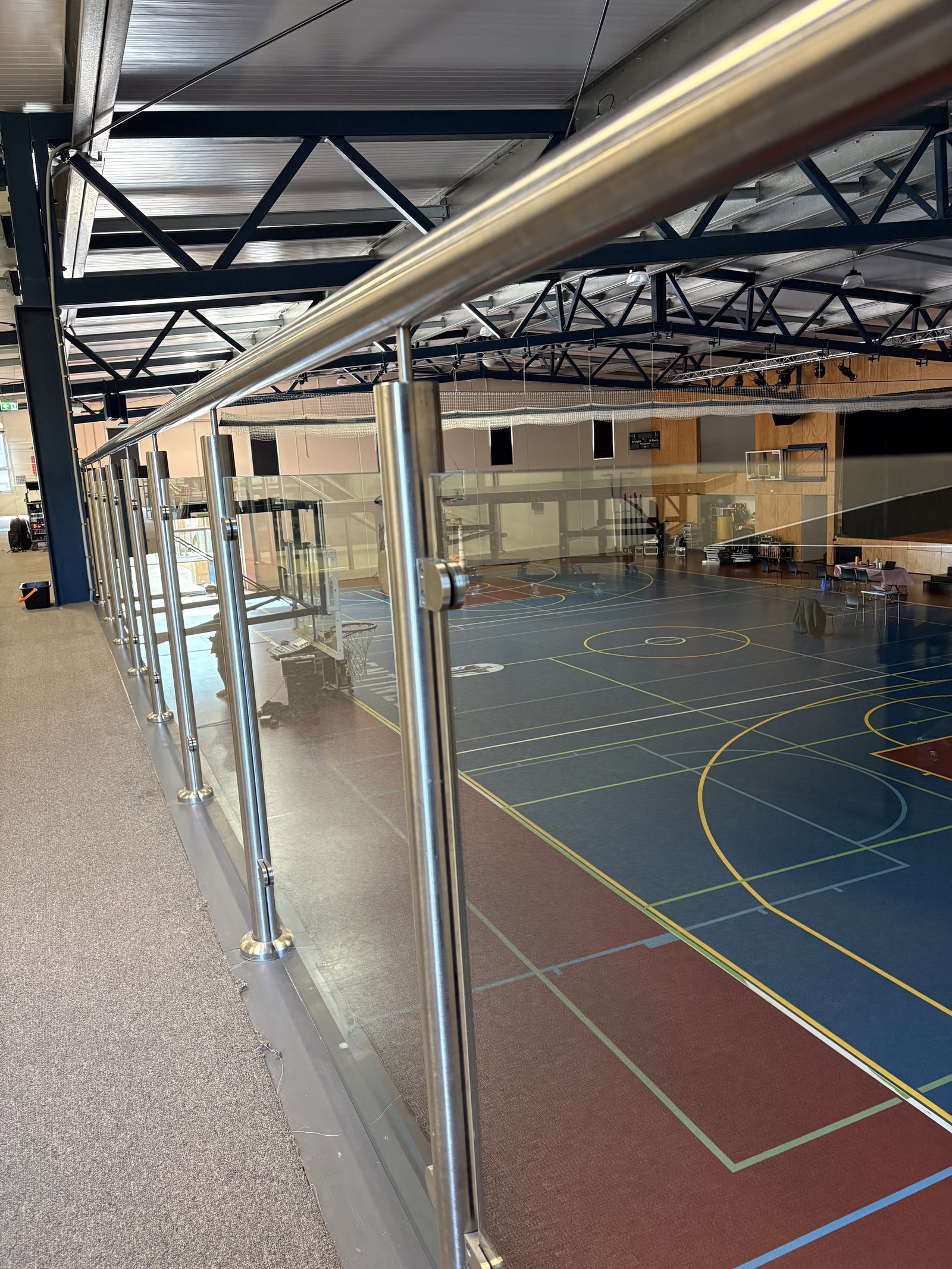 Glass balustrade — sports facility mezzanine